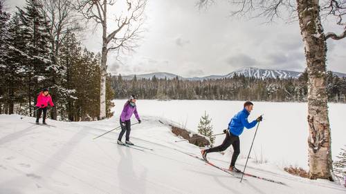 Nordic skiers with Sugarloaf in the backgroun