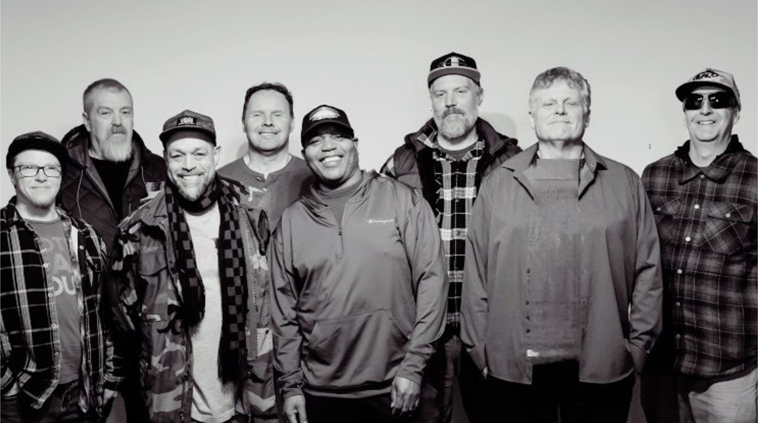 Catcha Vibe the band standing next to each other 