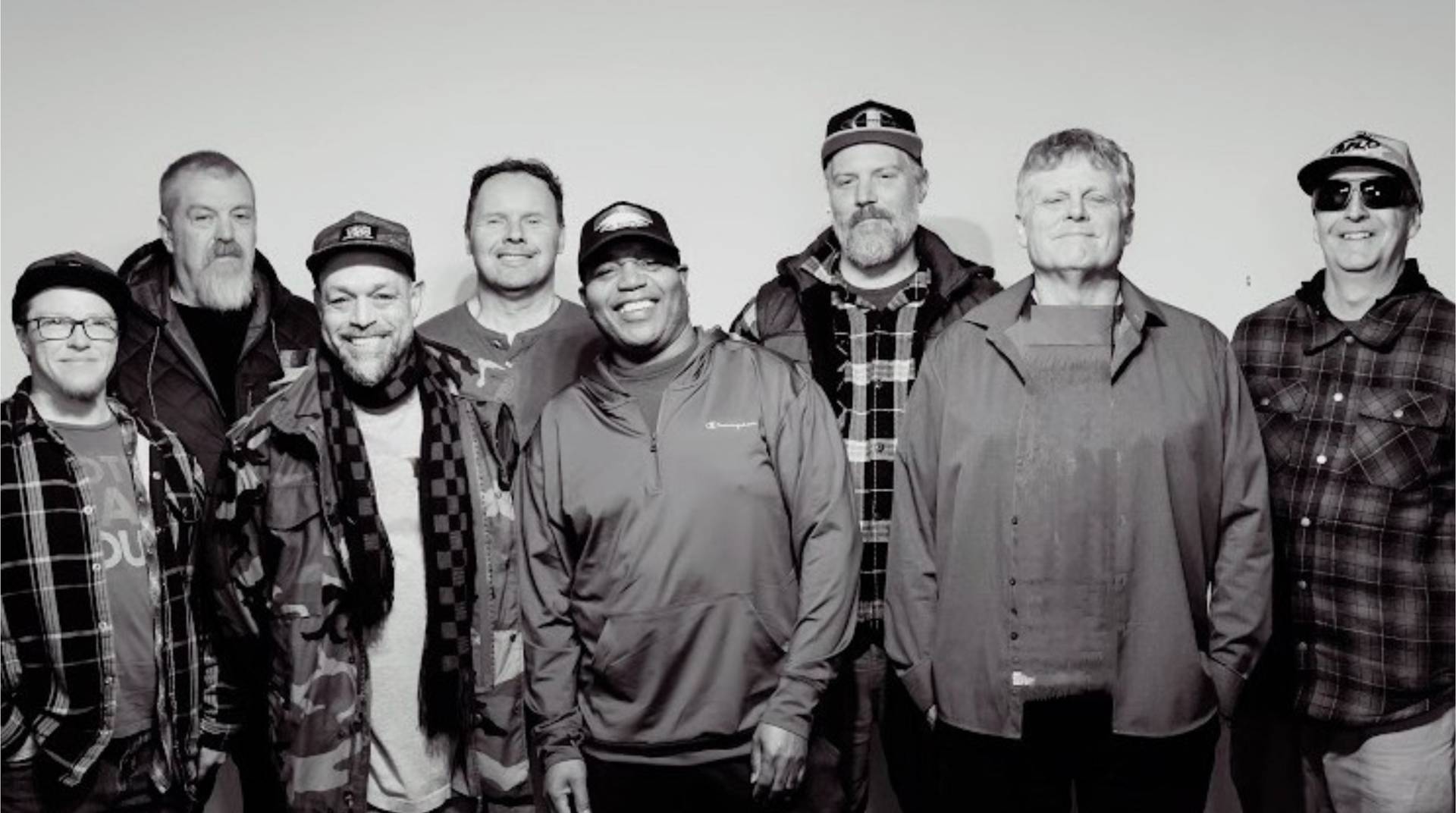 Catcha Vibe the band standing next to each other