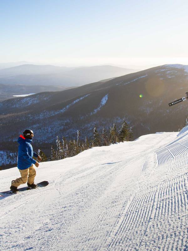snowboarder on corduroy in morning