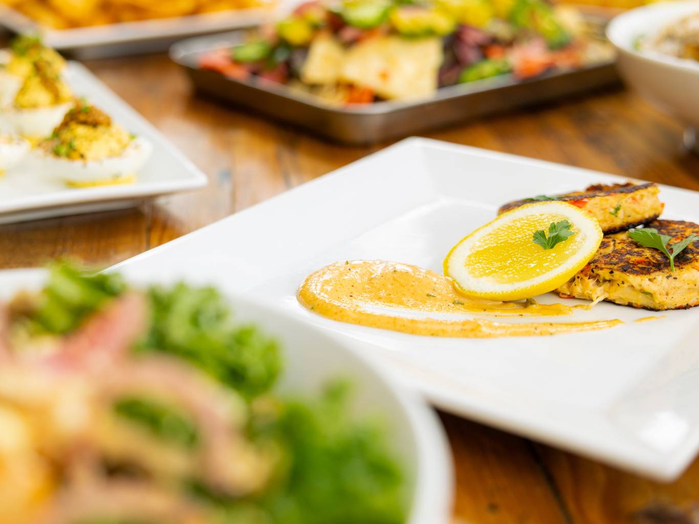 Crab cakes and lemon on dish