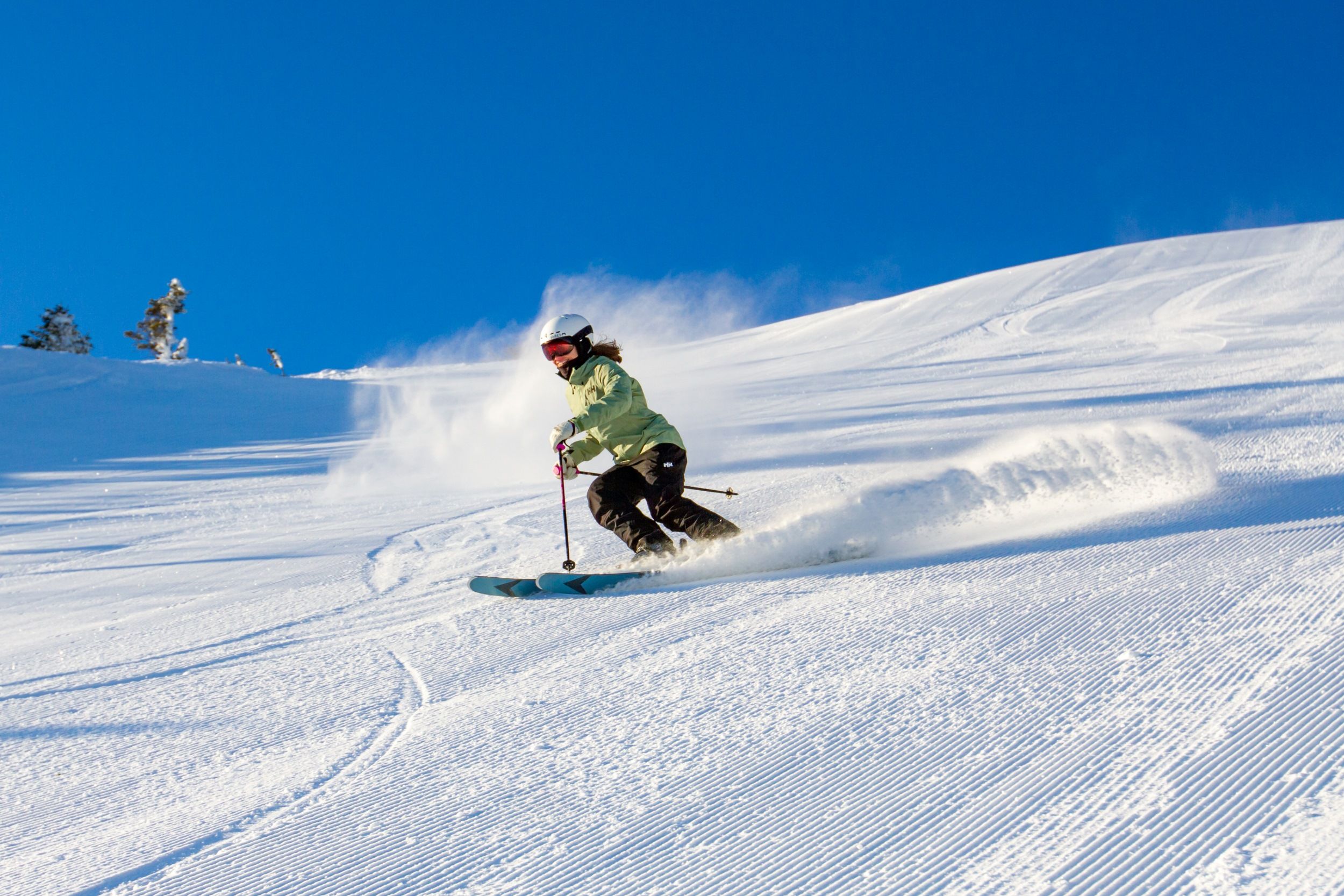Skier on groomer