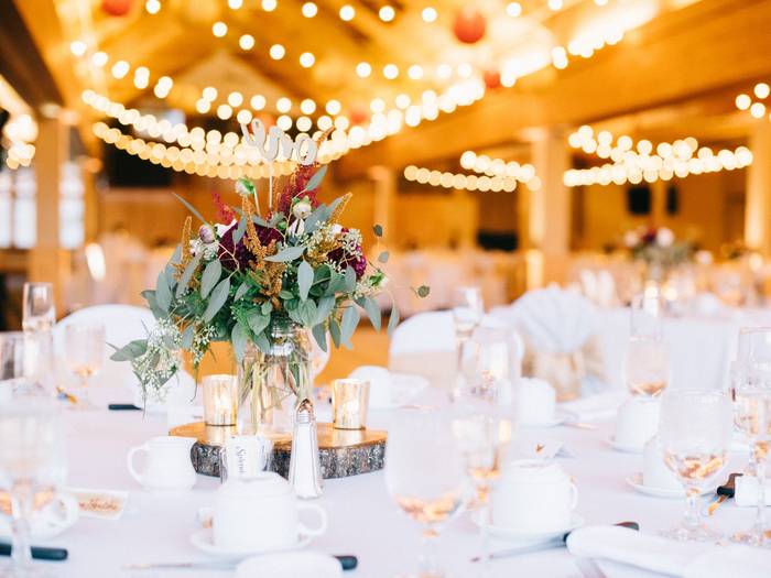 Beautiful table setting with string lights twinkling overhead