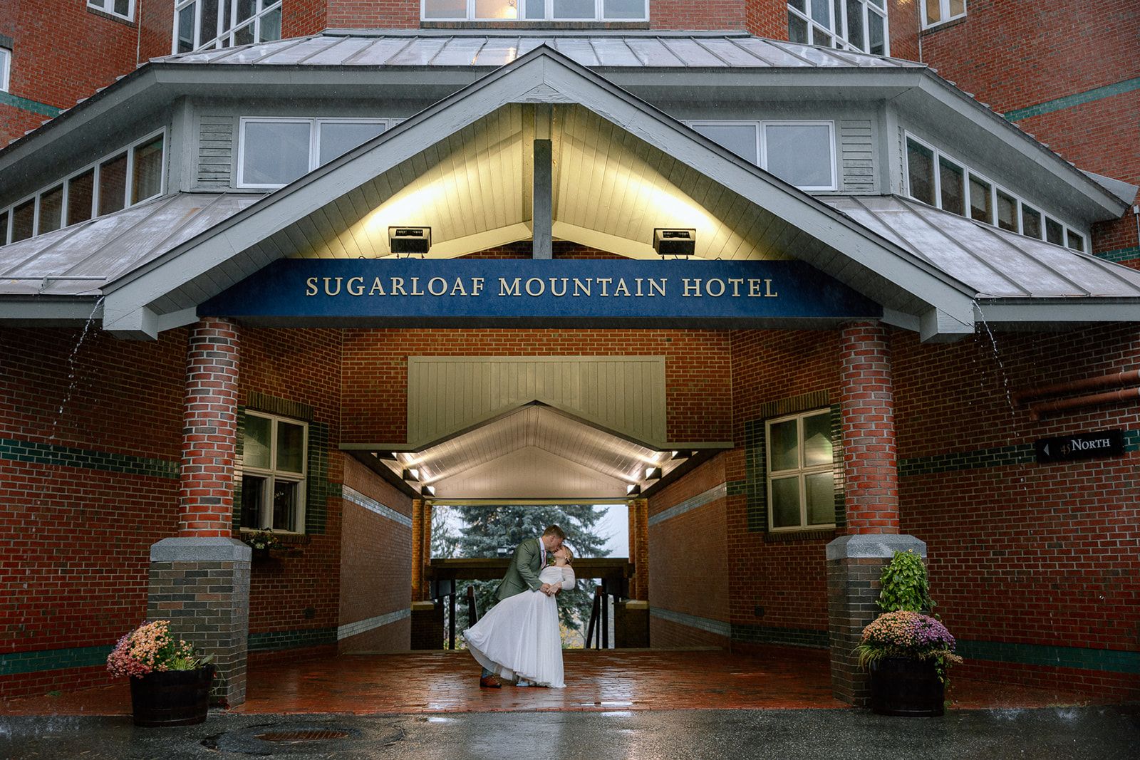 Bride and Groom under hotel awning