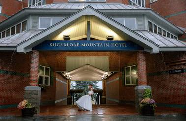 Bride and Groom under hotel awning