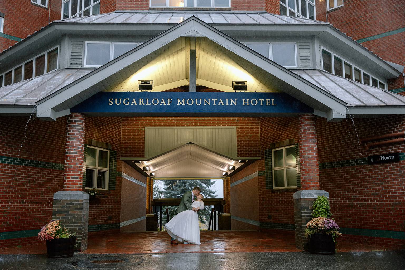 Bride and Groom under hotel awning