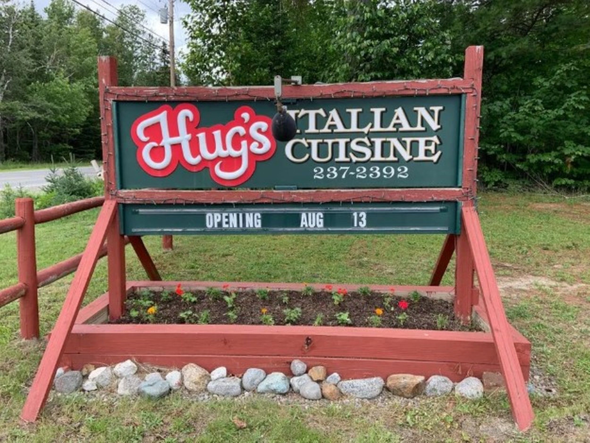Hug's Italian Cuisine sign on the side of Route 27 