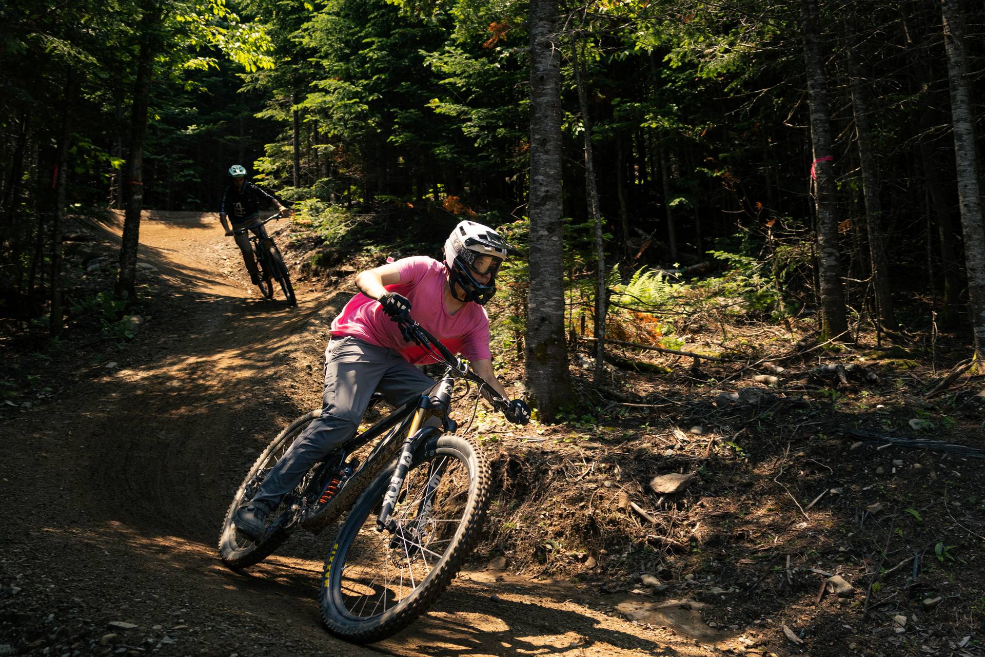 Mountain bikers on berm