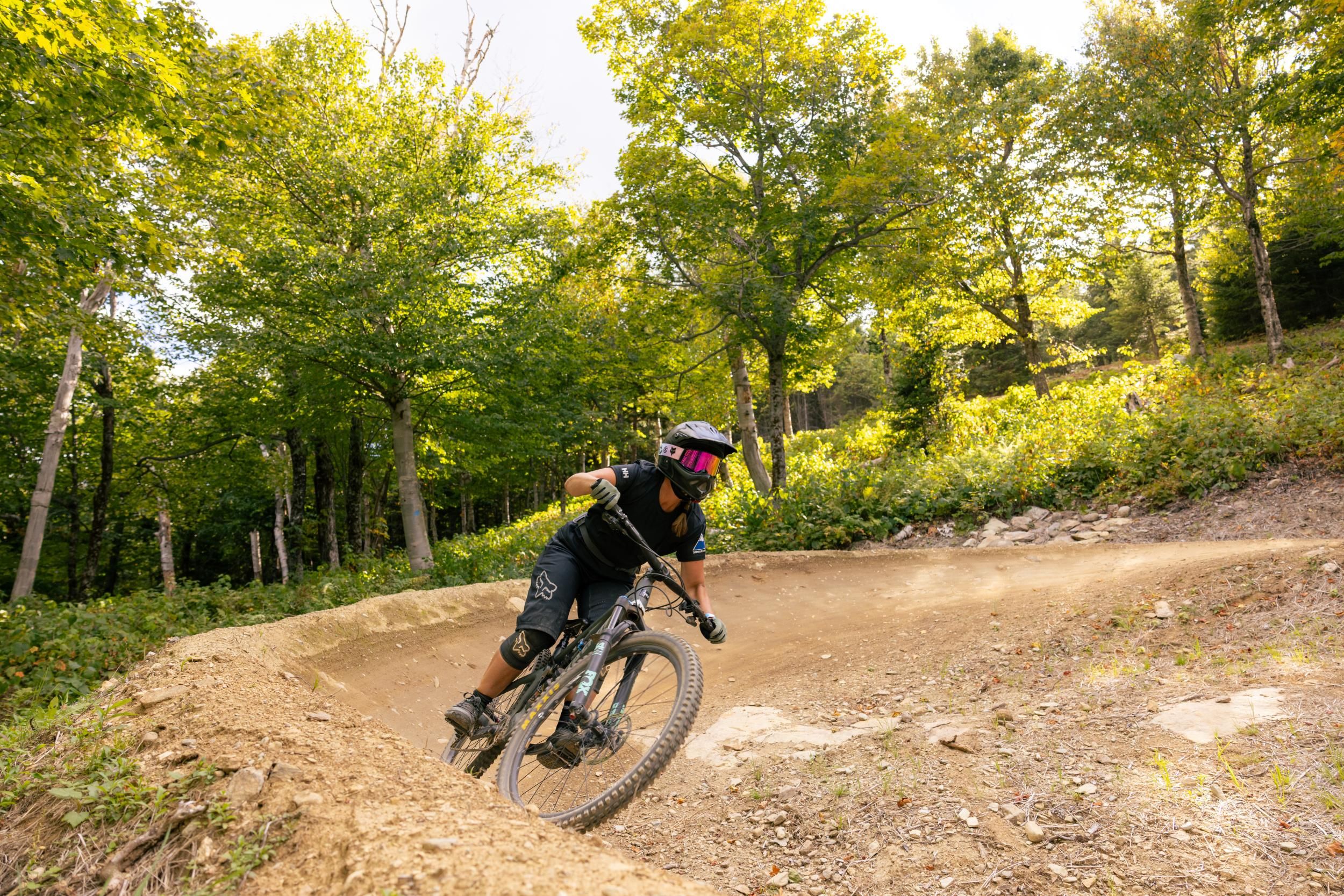 Female mountain biker on berm