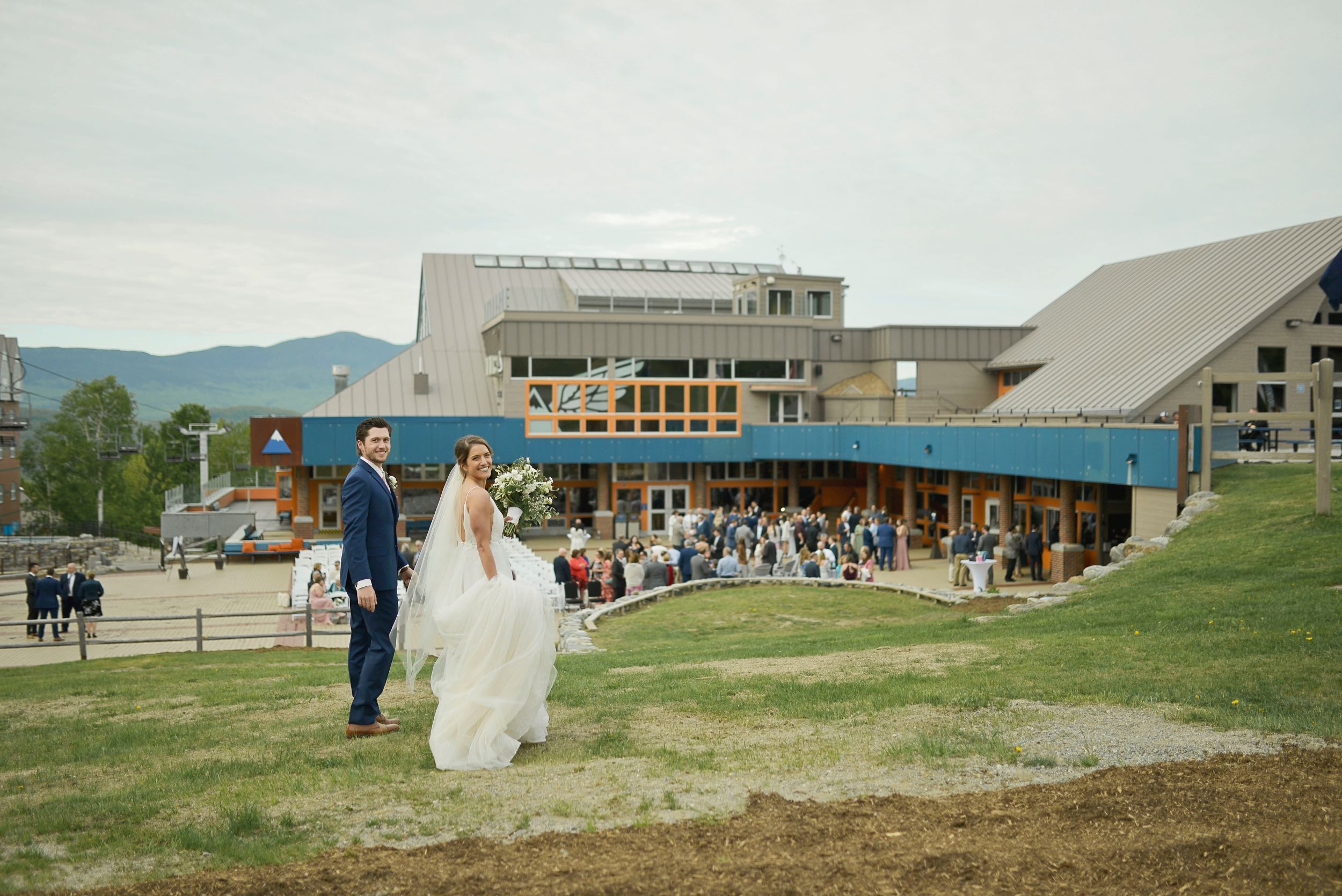 A bride and groom smiling at their wedding on The Beach 