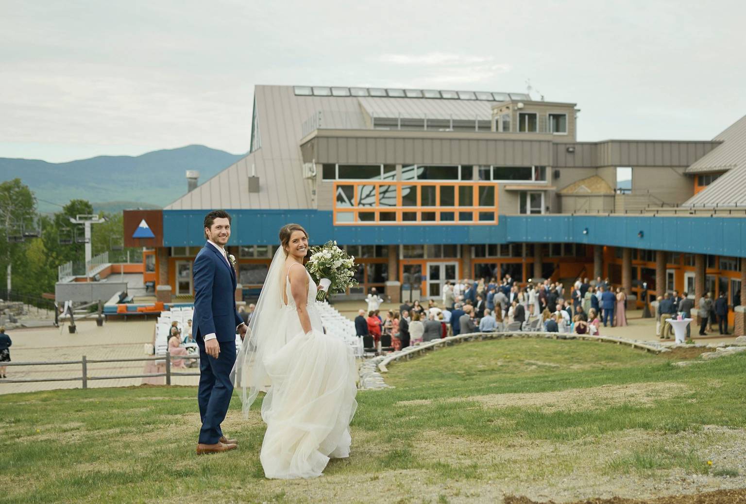 A bride and groom smiling at their wedding on The Beach