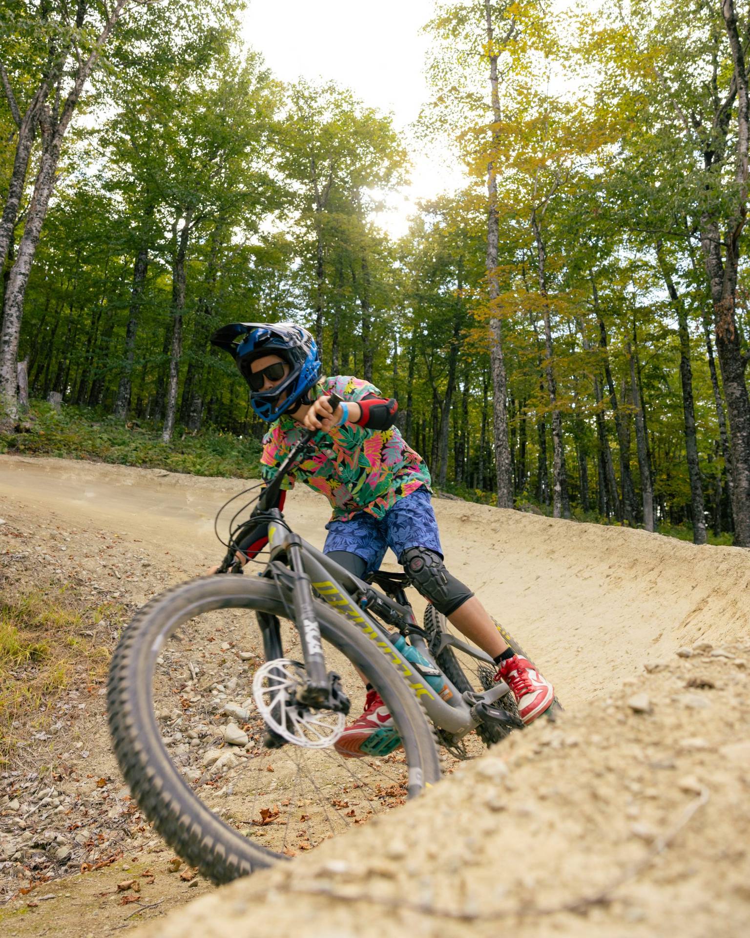 Young biker on berm