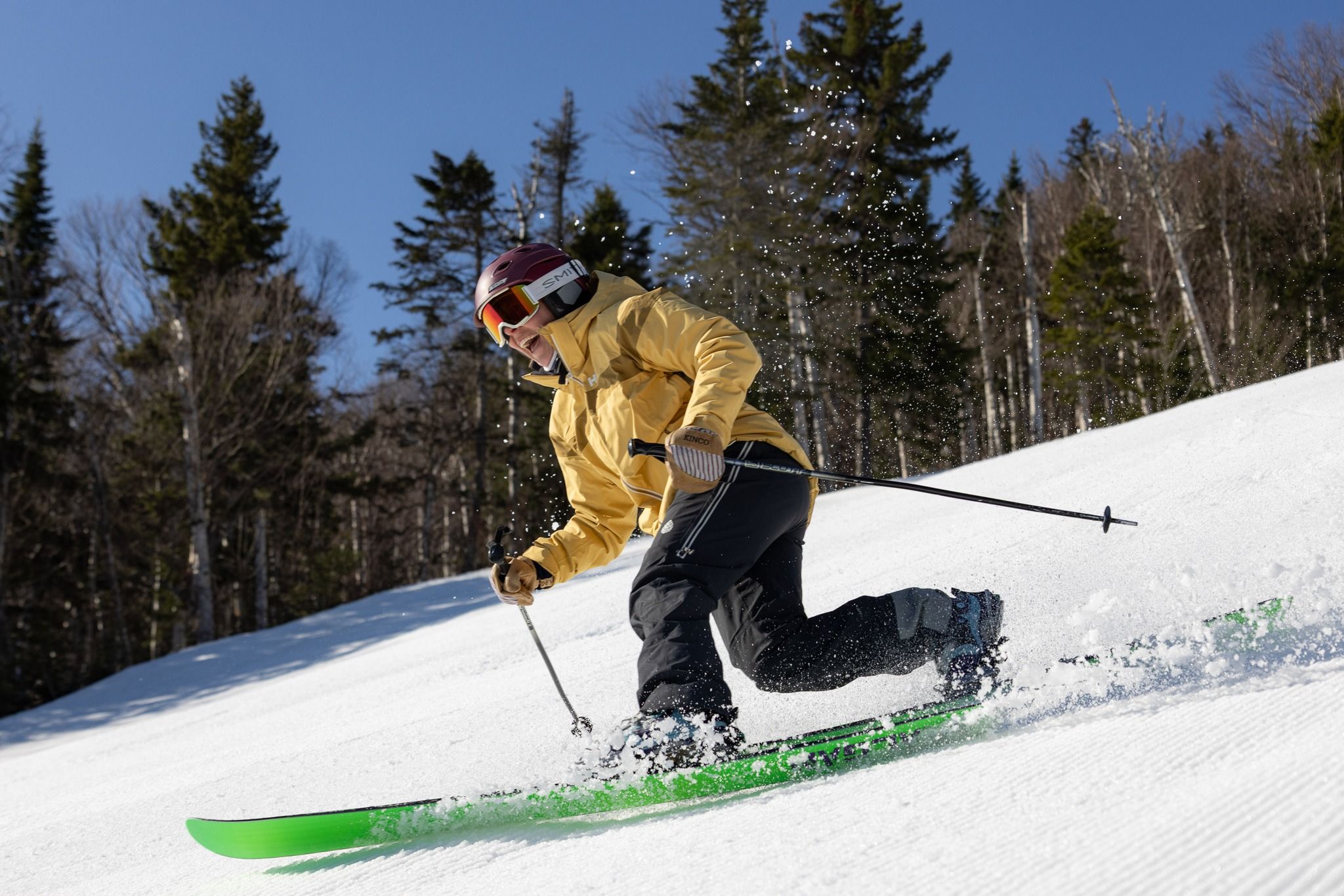 tele skier in yellow
