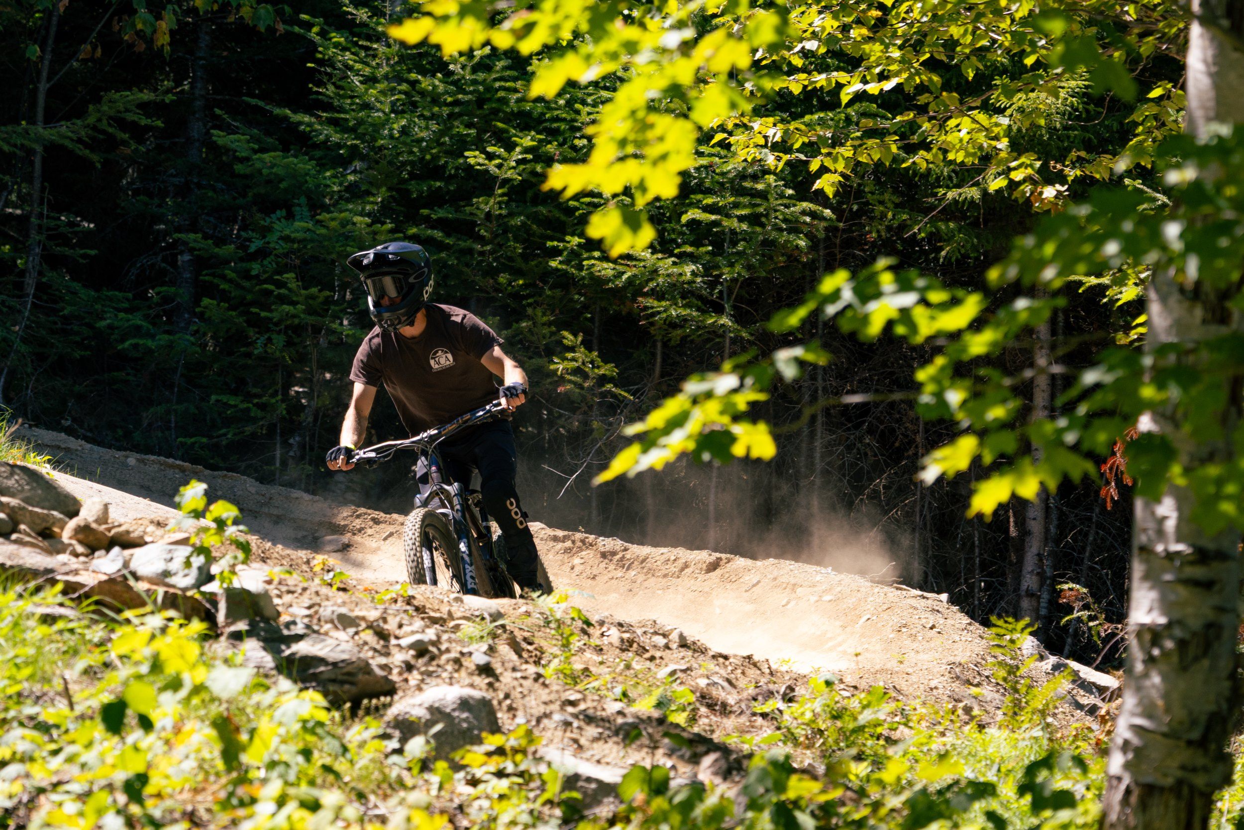 Biker looking ahead on berm