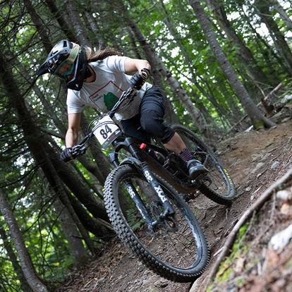 Coach Annie Craig on a rooty trail