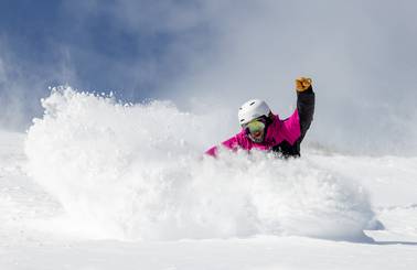 Snowboarder in powder