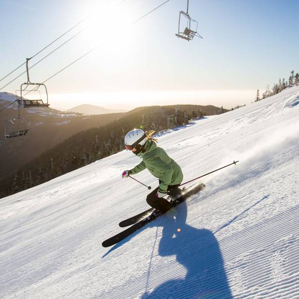 Skier on groomed terrain