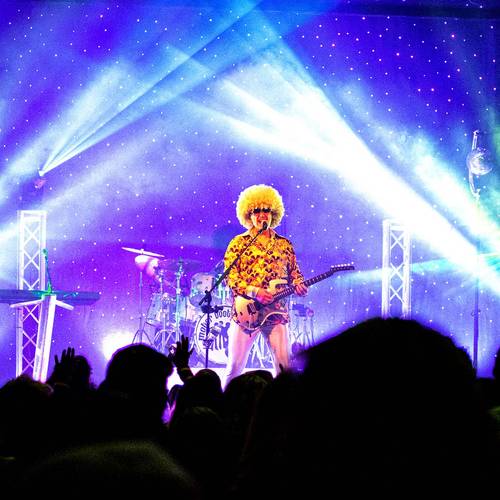 three band members on stage