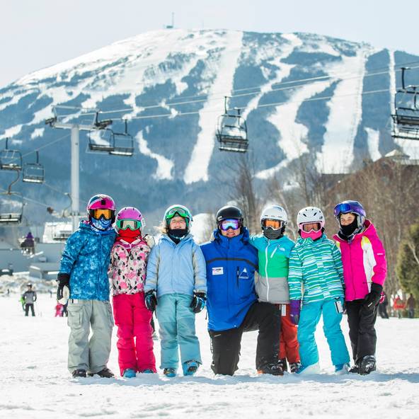 Children on slope with instructor