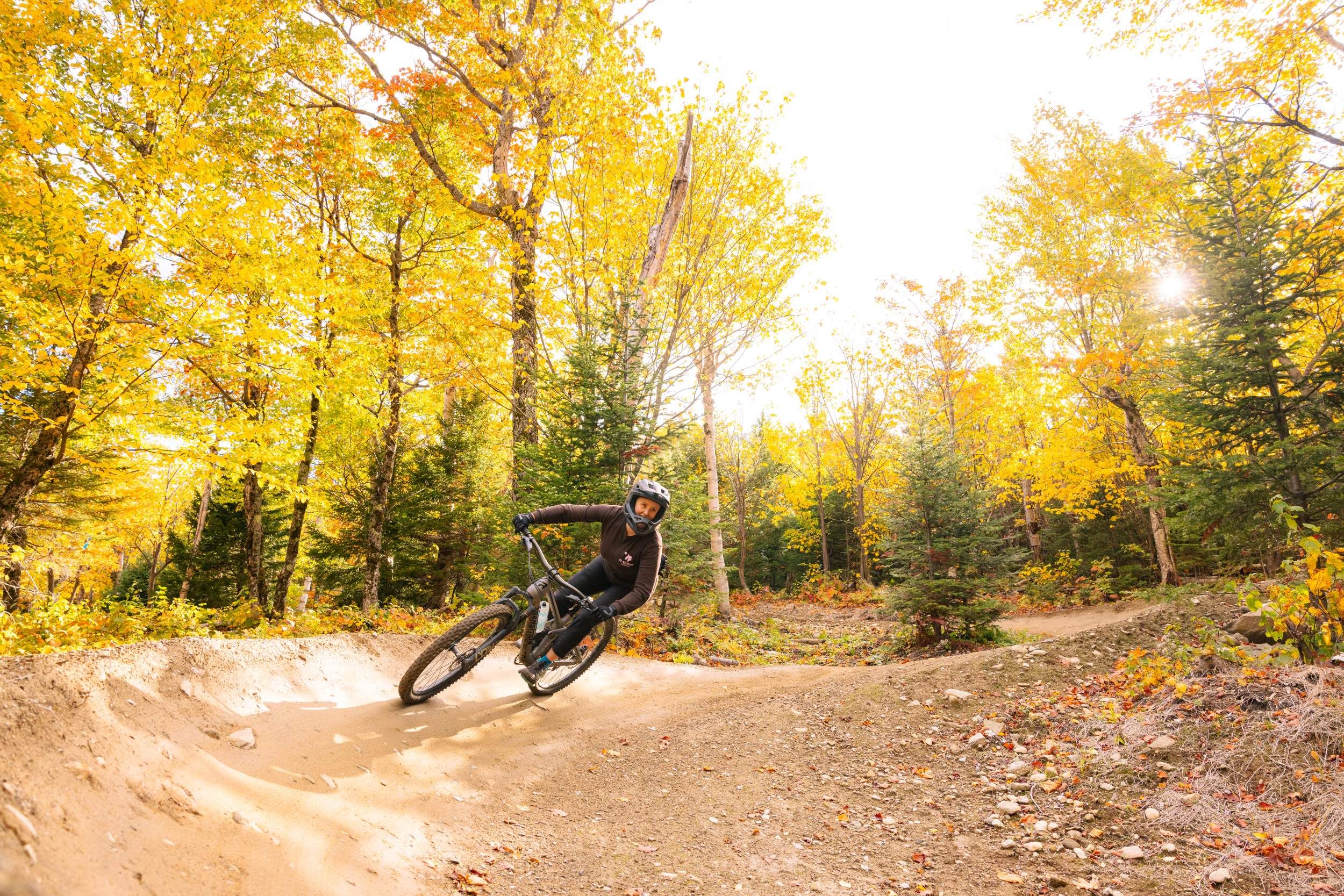 Female mountain biker on berm