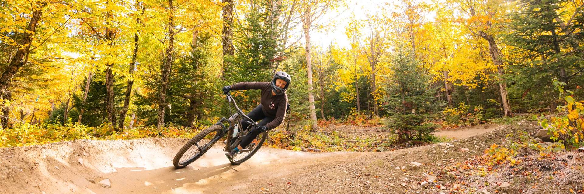 Female mountain biker on berm