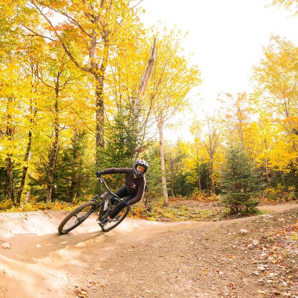 Biker amongst fall foliage