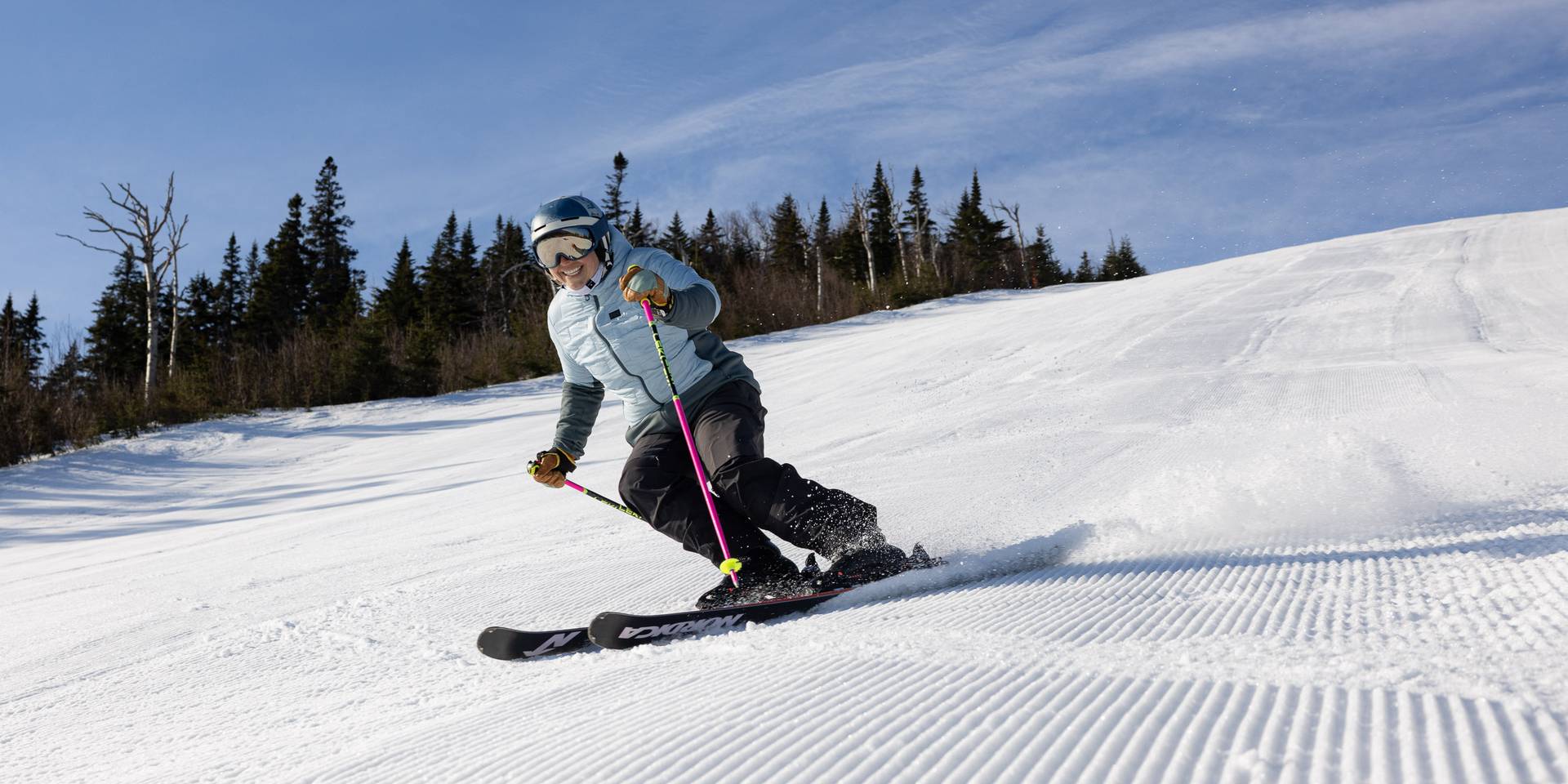 Skier in blue jacket