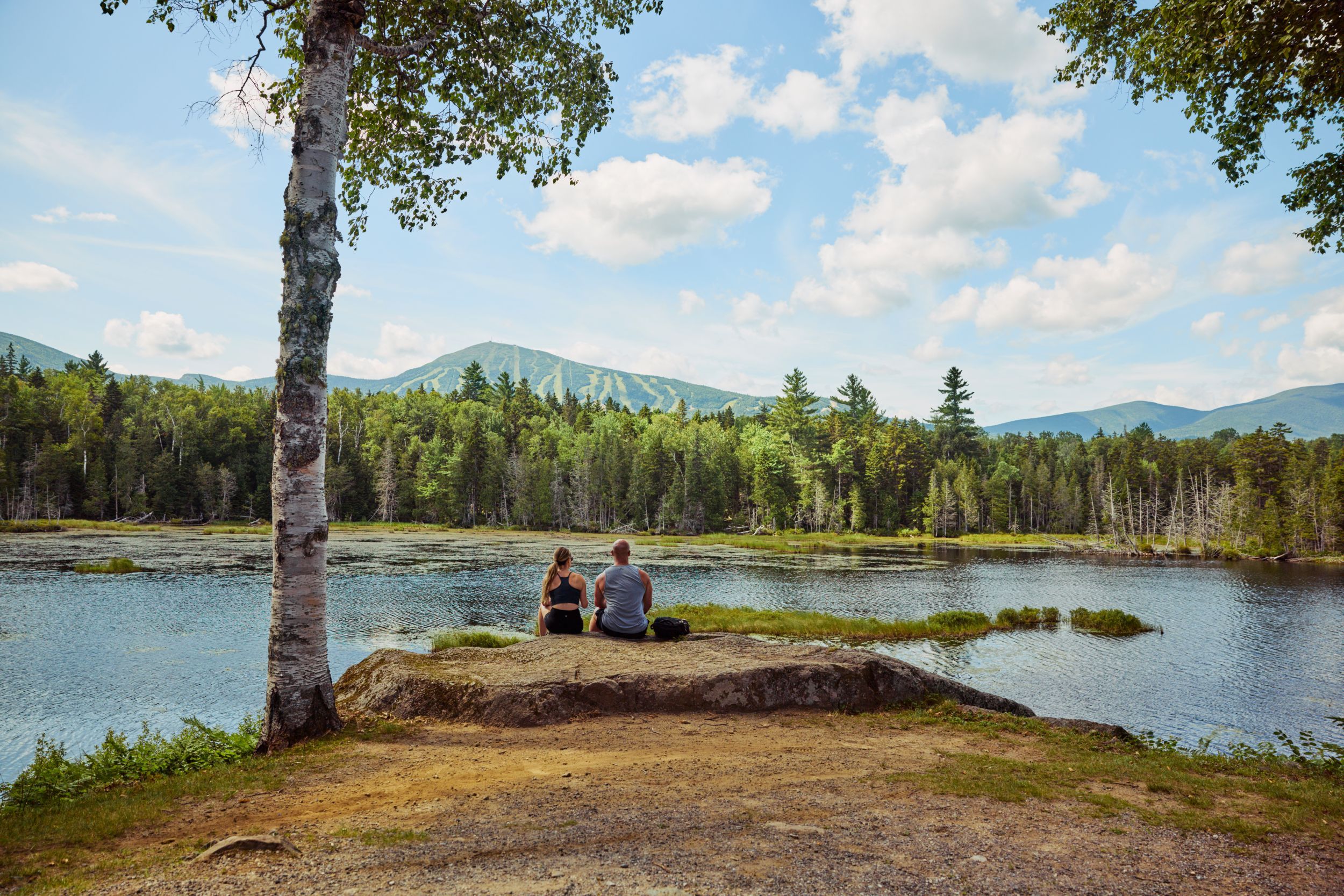 Couple sitting on rock