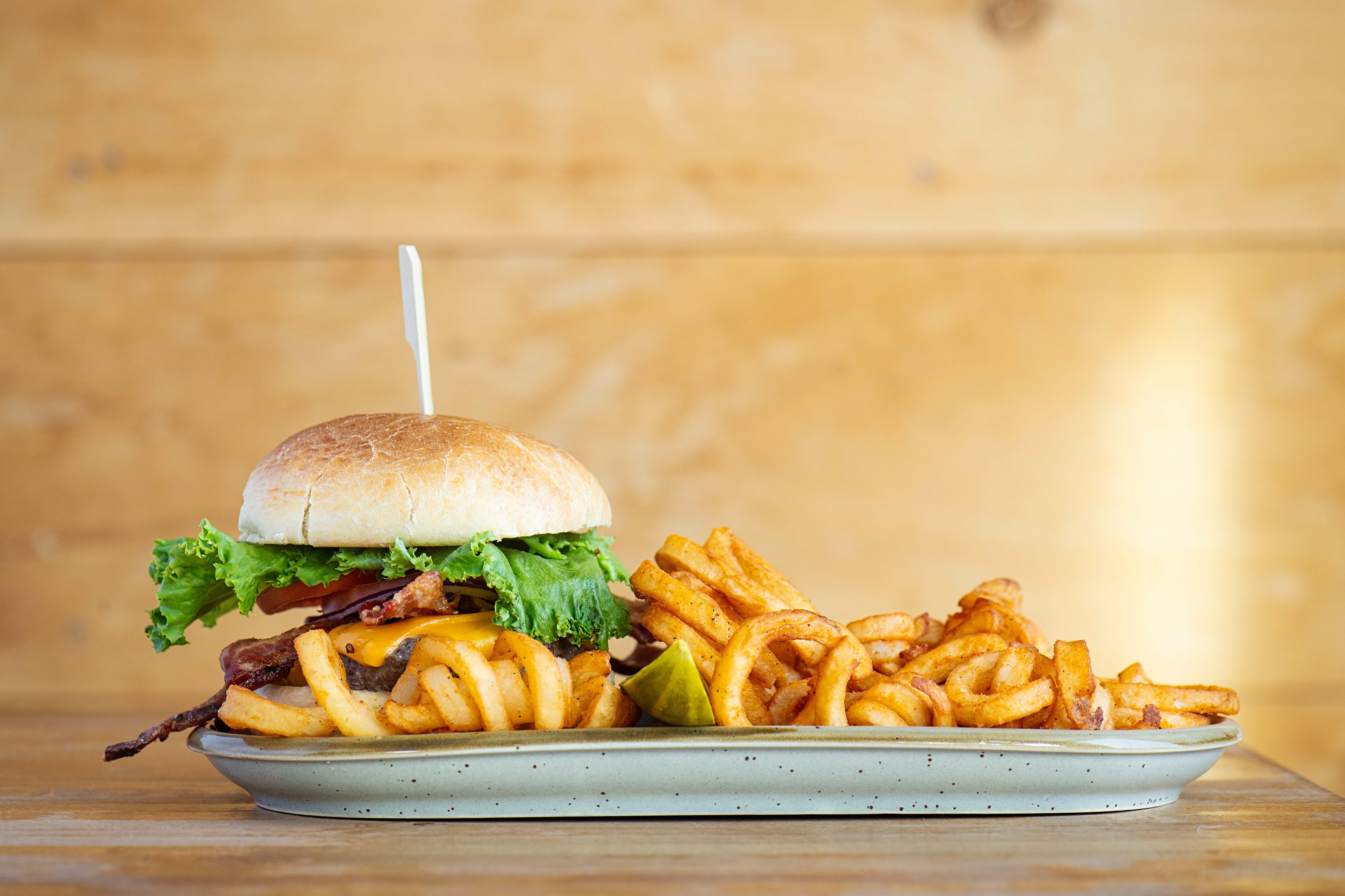 Bullwinkle's burger with a pile of the best variation of fry: curly
