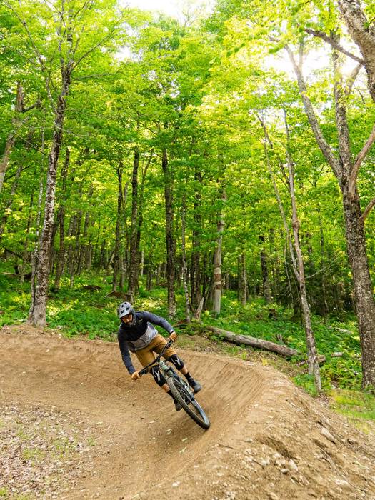 Tall, handsome male biker executing a perfect turn