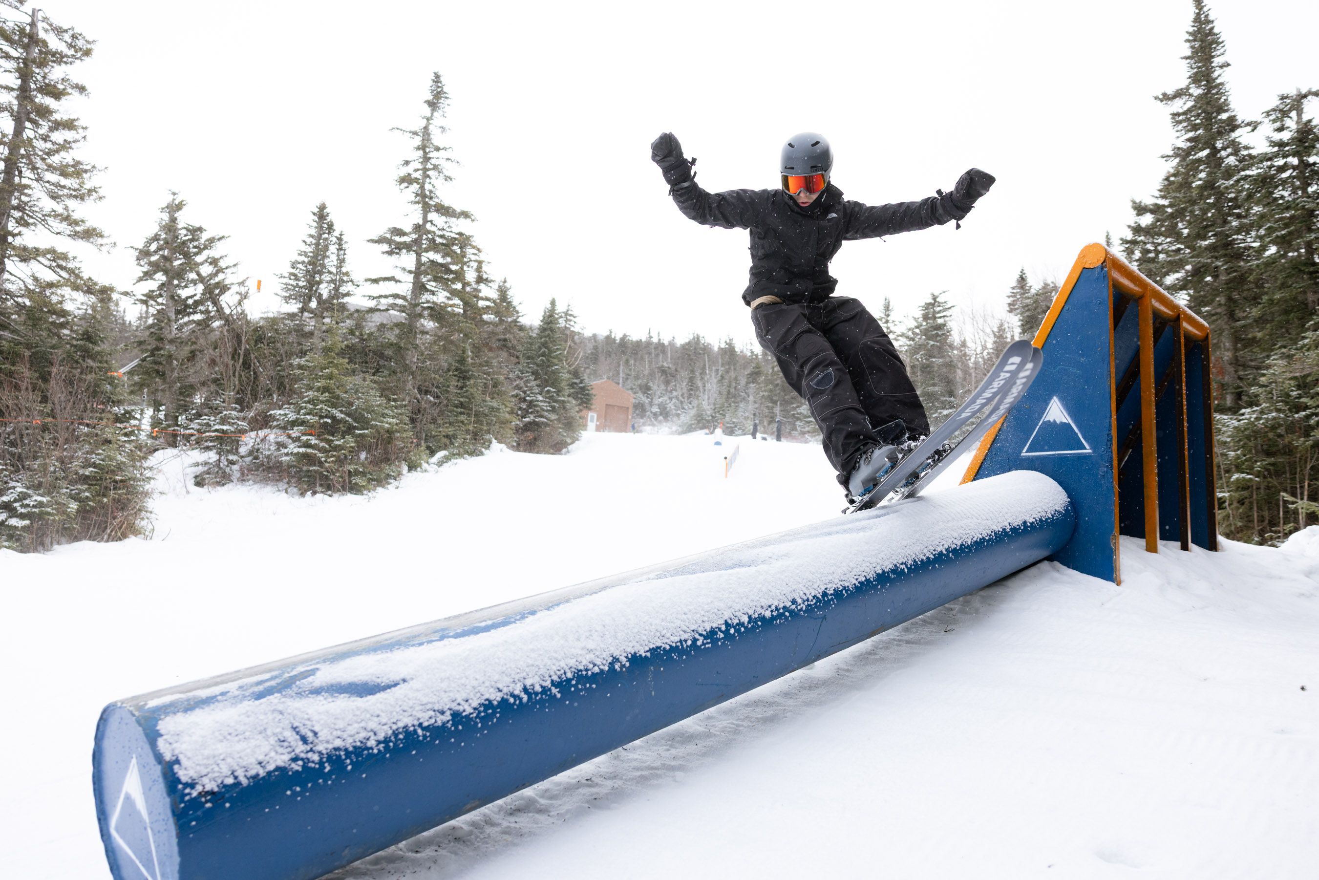 Skier on park rail