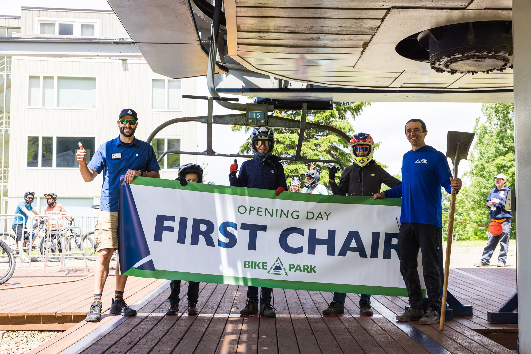 group of people holding first chair banner