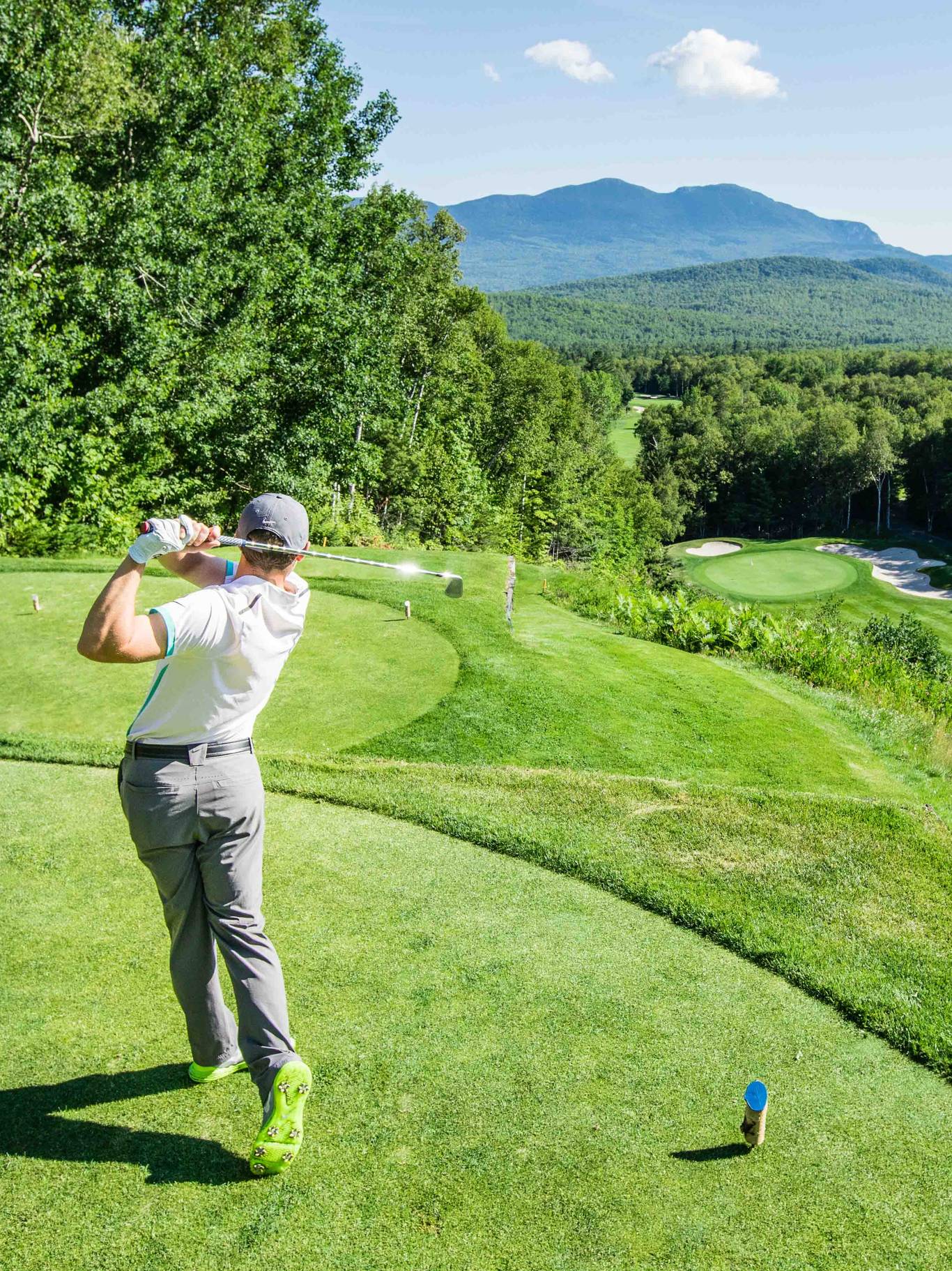 Golfer looking out over mountain vista