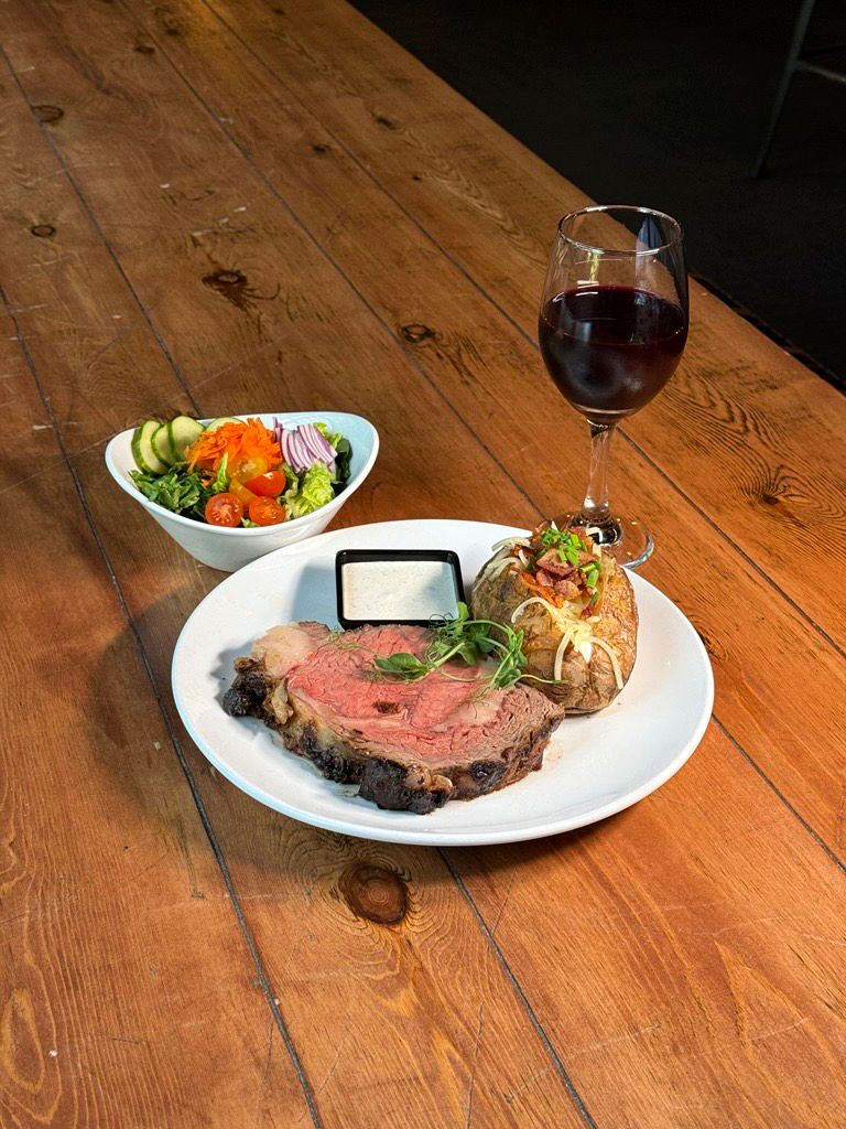 Prime rib and a glass of wine