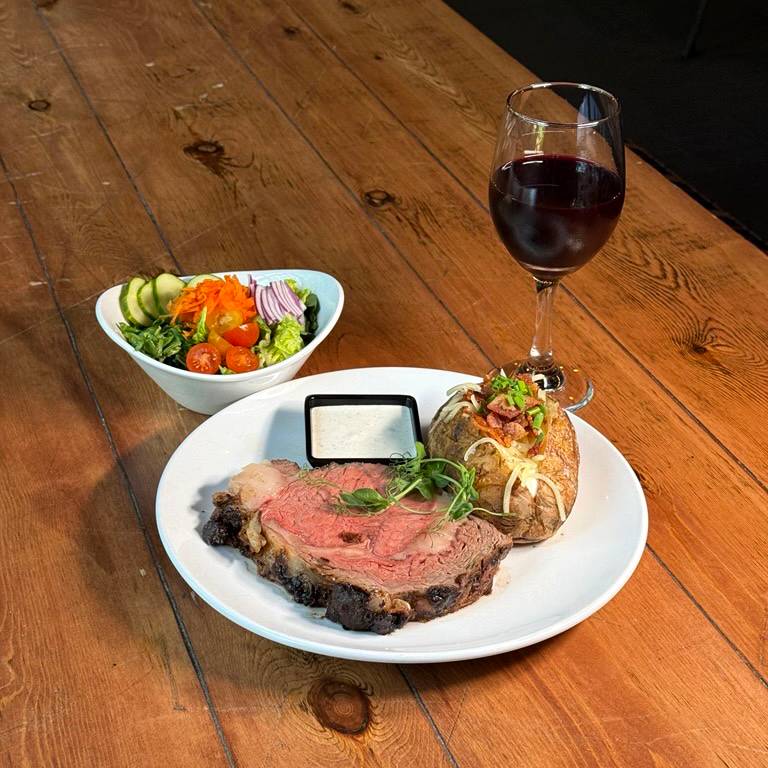 Prime rib and a glass of wine