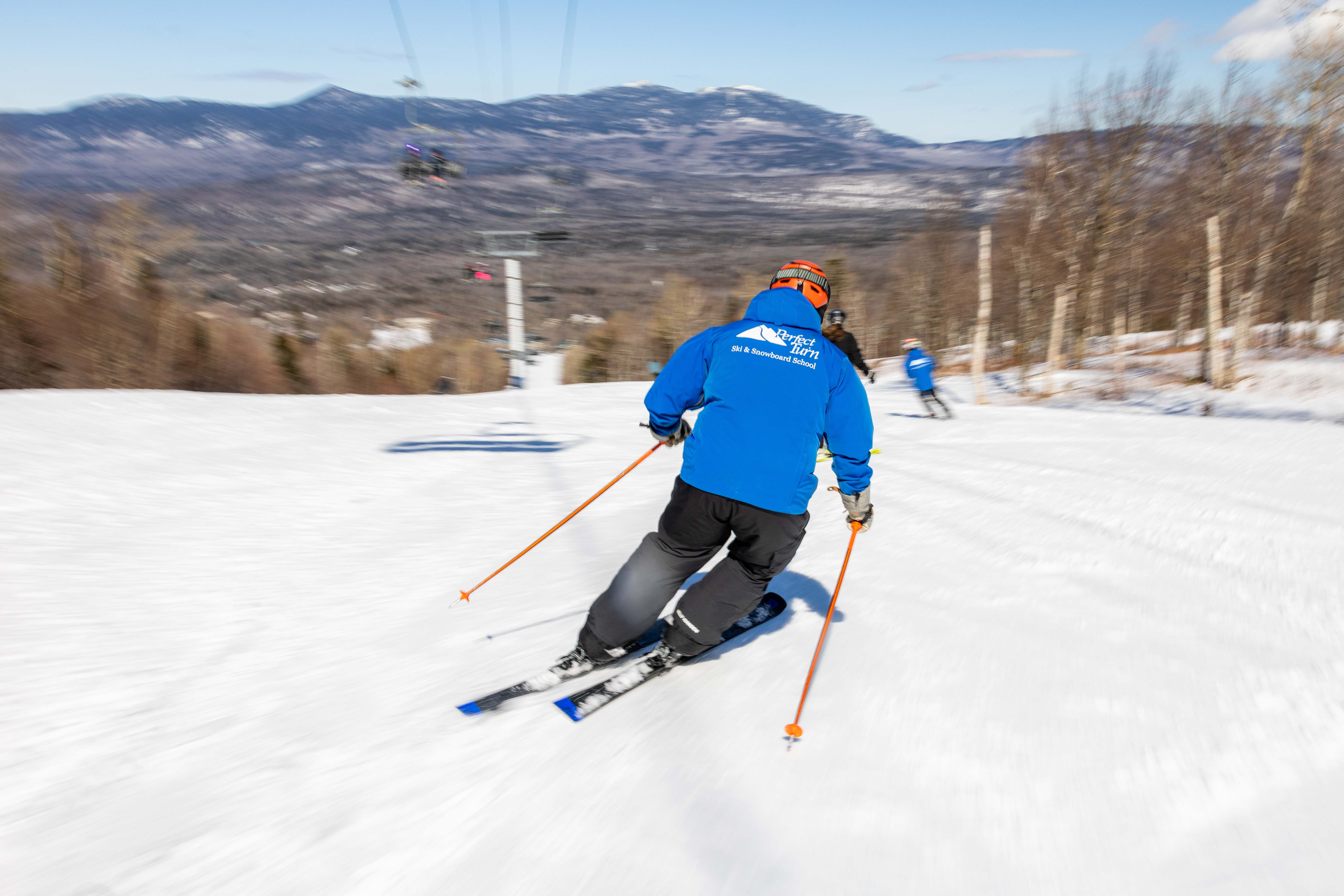 Ski school instructor skiing