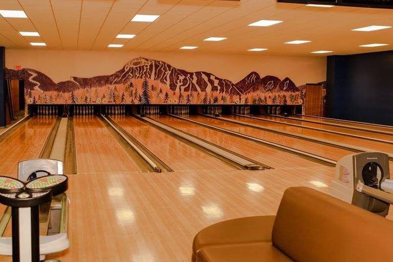 8 bowling lanes below a Sugarloaf mural at the SugarBowl
