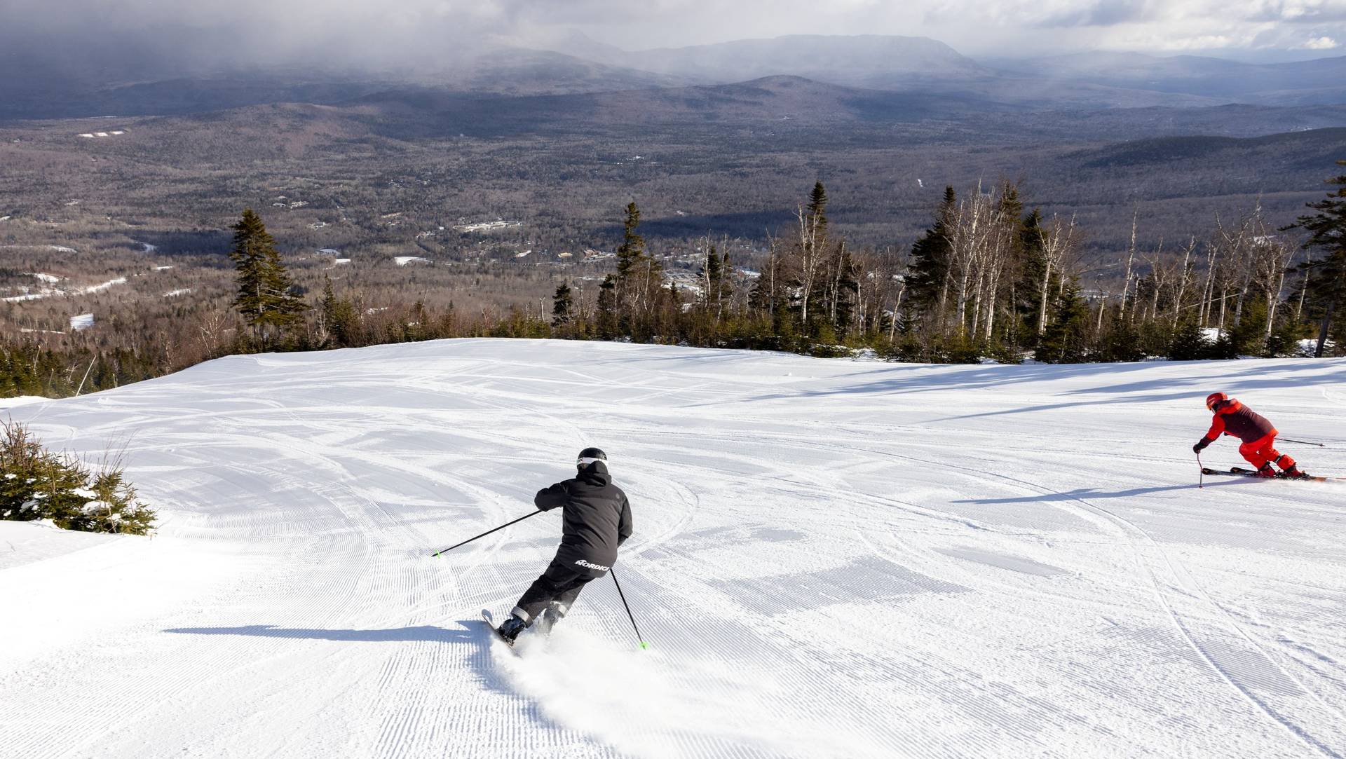 Two skiers on King Pine trail