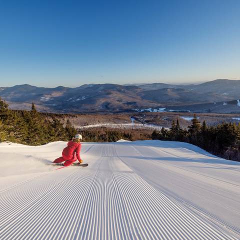 Skier on fresh corduroy.