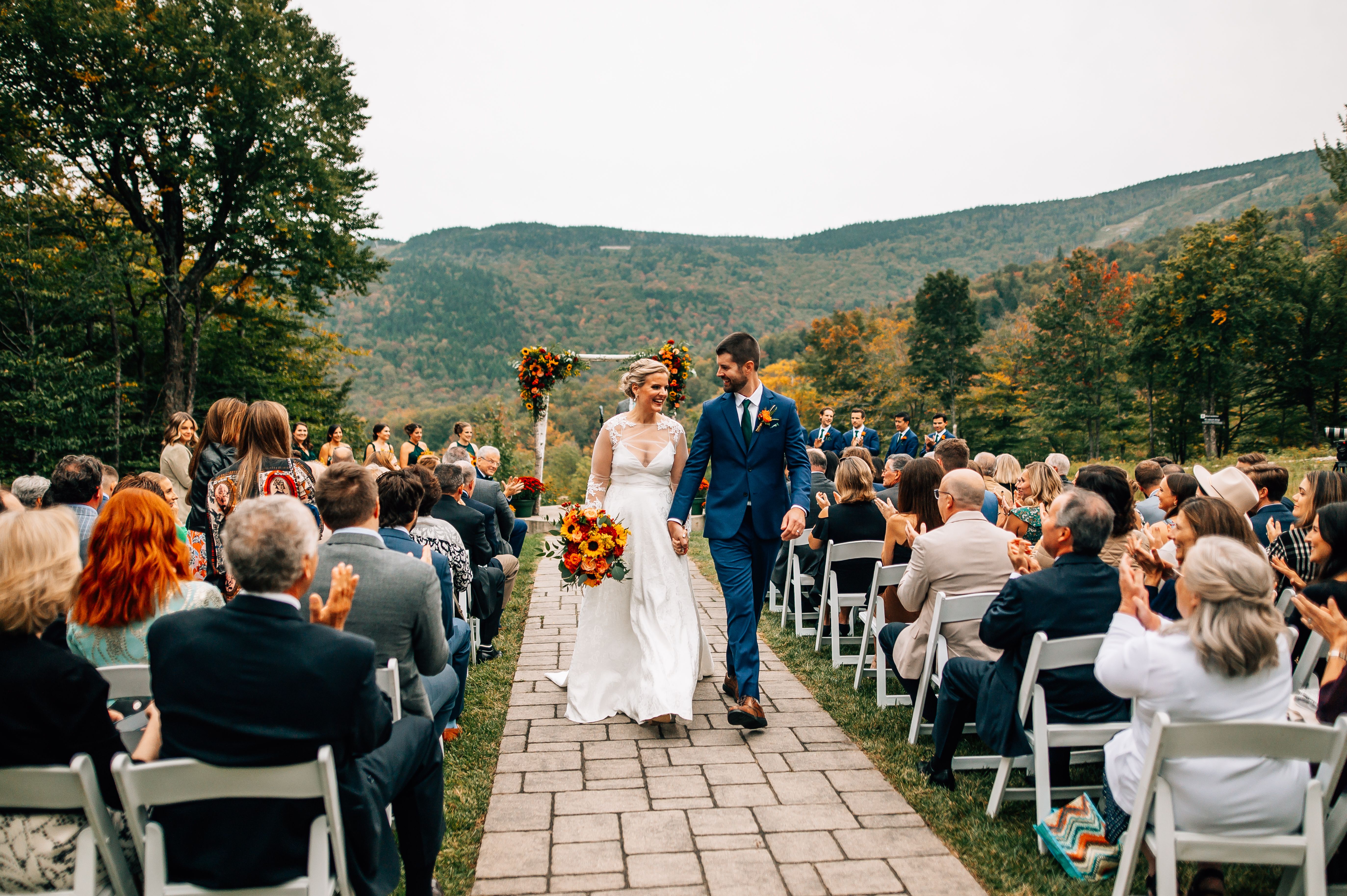 A couple walking and holding hands after their wedding Ceremony