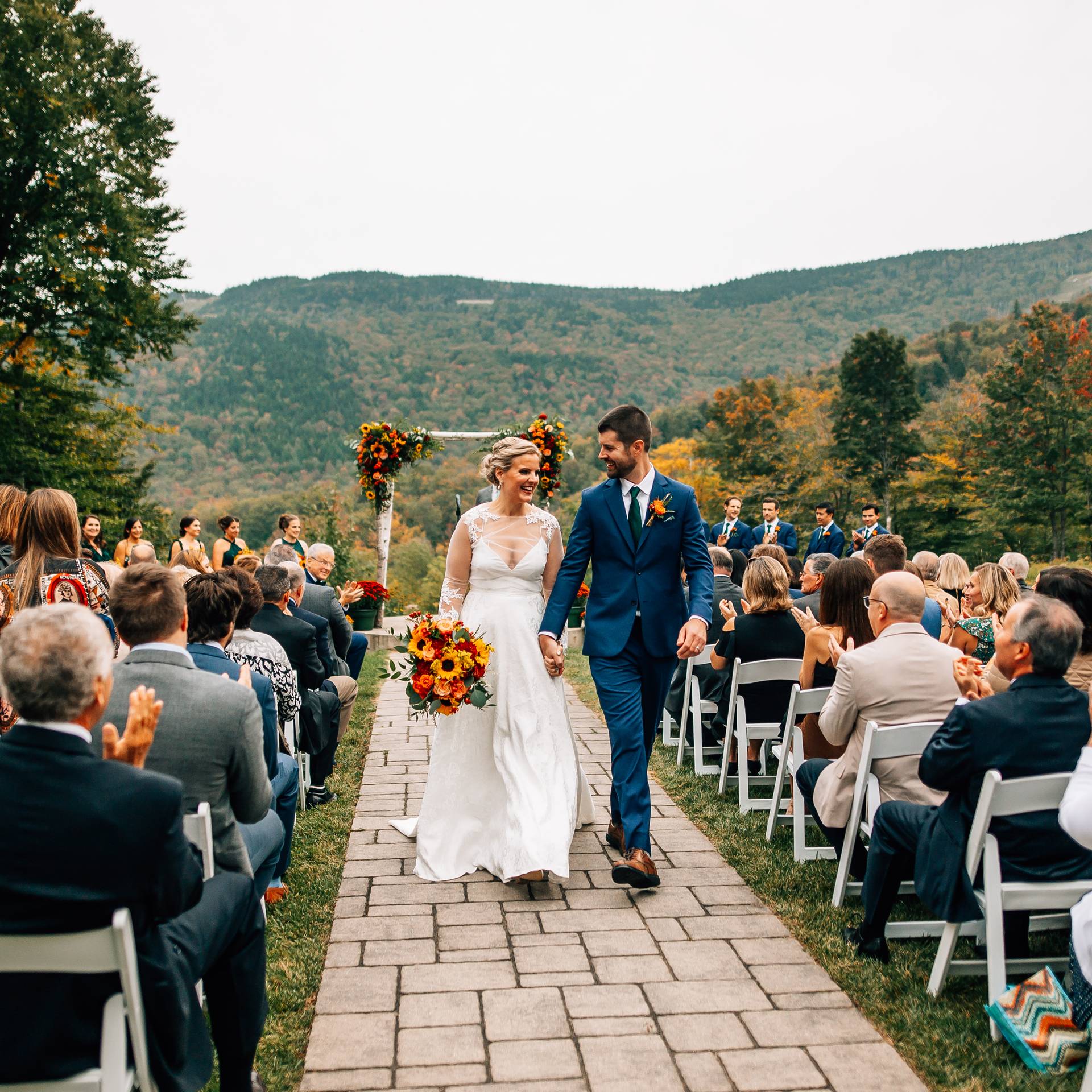 A couple walking and holding hands after their wedding Ceremony