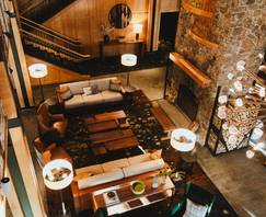 The Jordan Hotel lobby with a stone fireplace and wood accents.