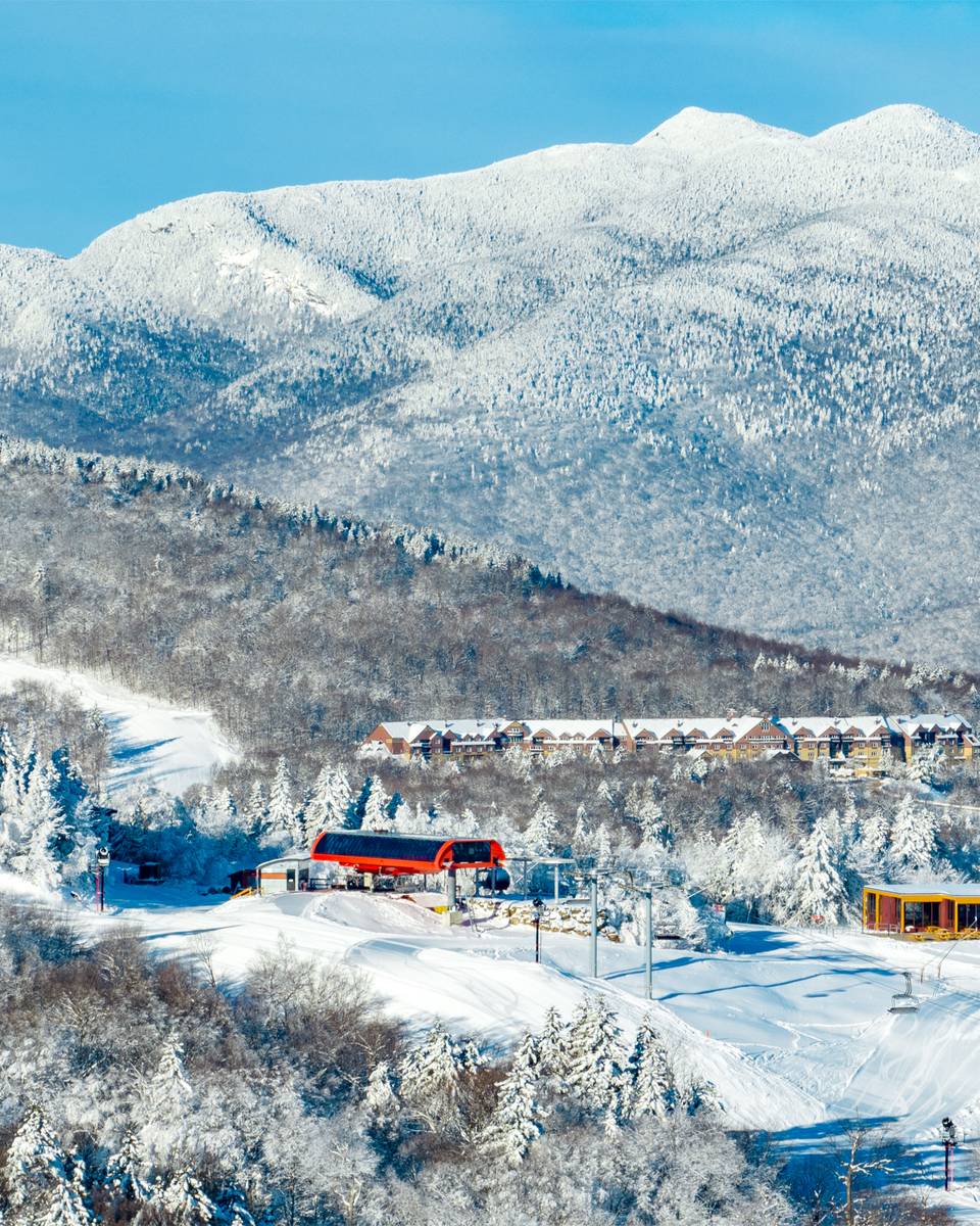 A scenic view of the North Peak Lodge with the Jordan Hotel in the background.