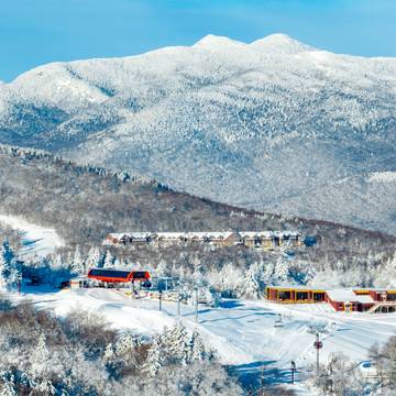 The Jordan Hotel in snow with Chairlift at Sunday River, Maine