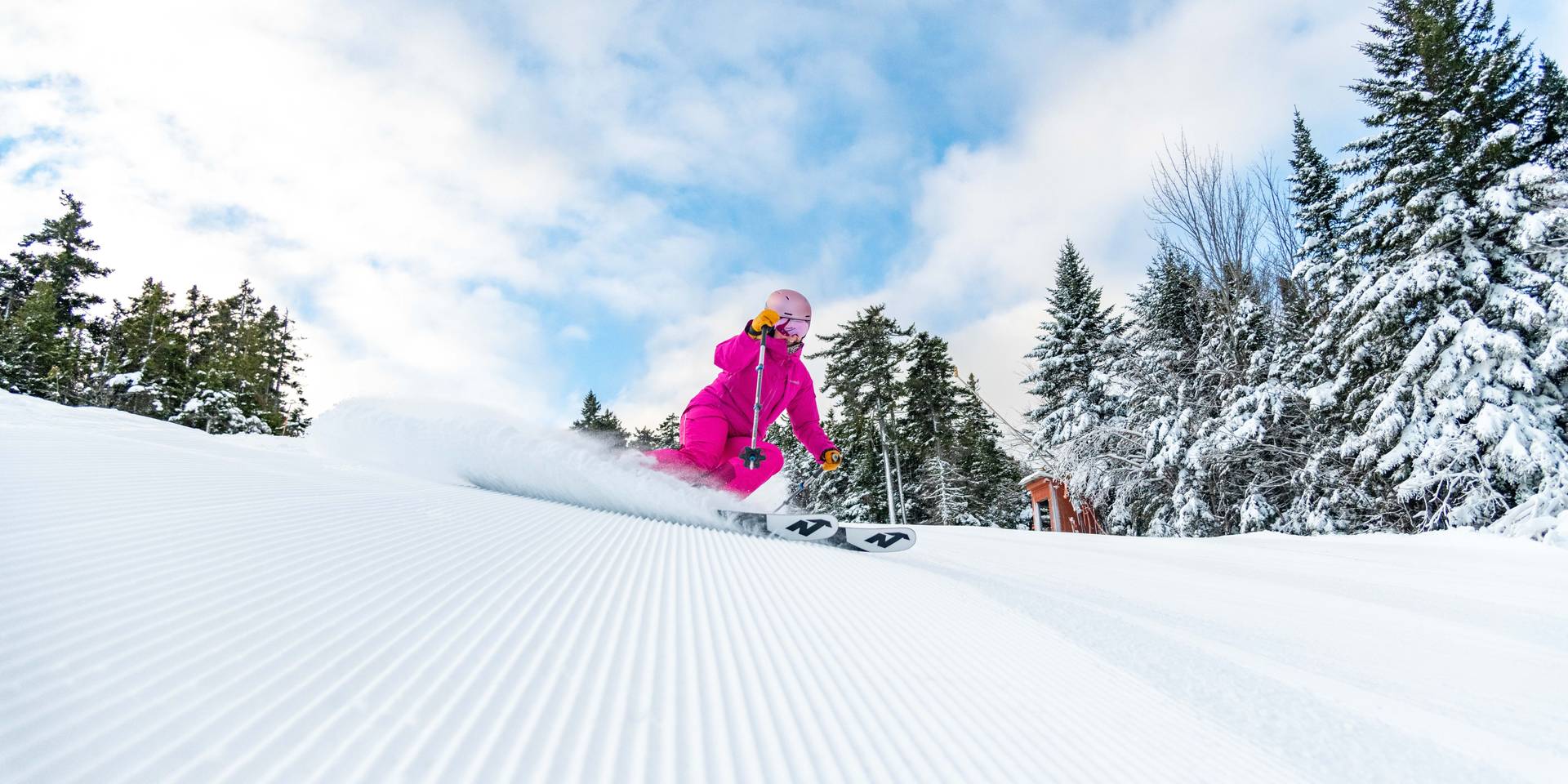A person skiing down a trail at Sunday River.