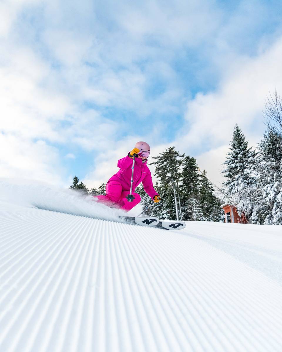 Skier on corduroy on Locke Peak.