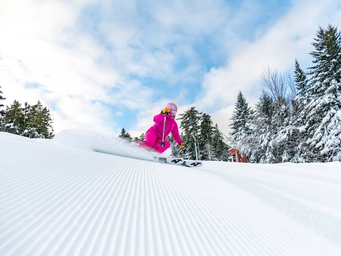 Skier on corduroy on Locke Peak.
