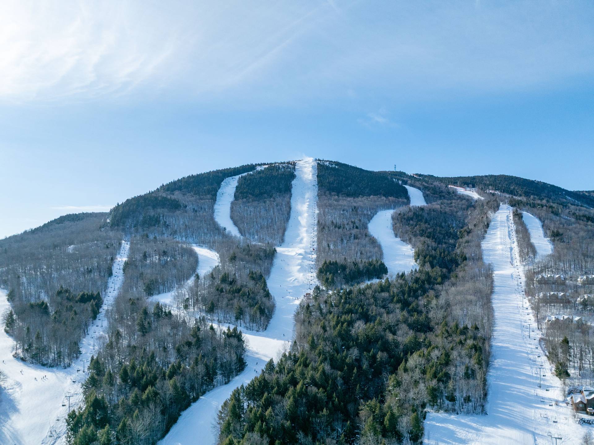 A man skiing in powder at Sunday River.