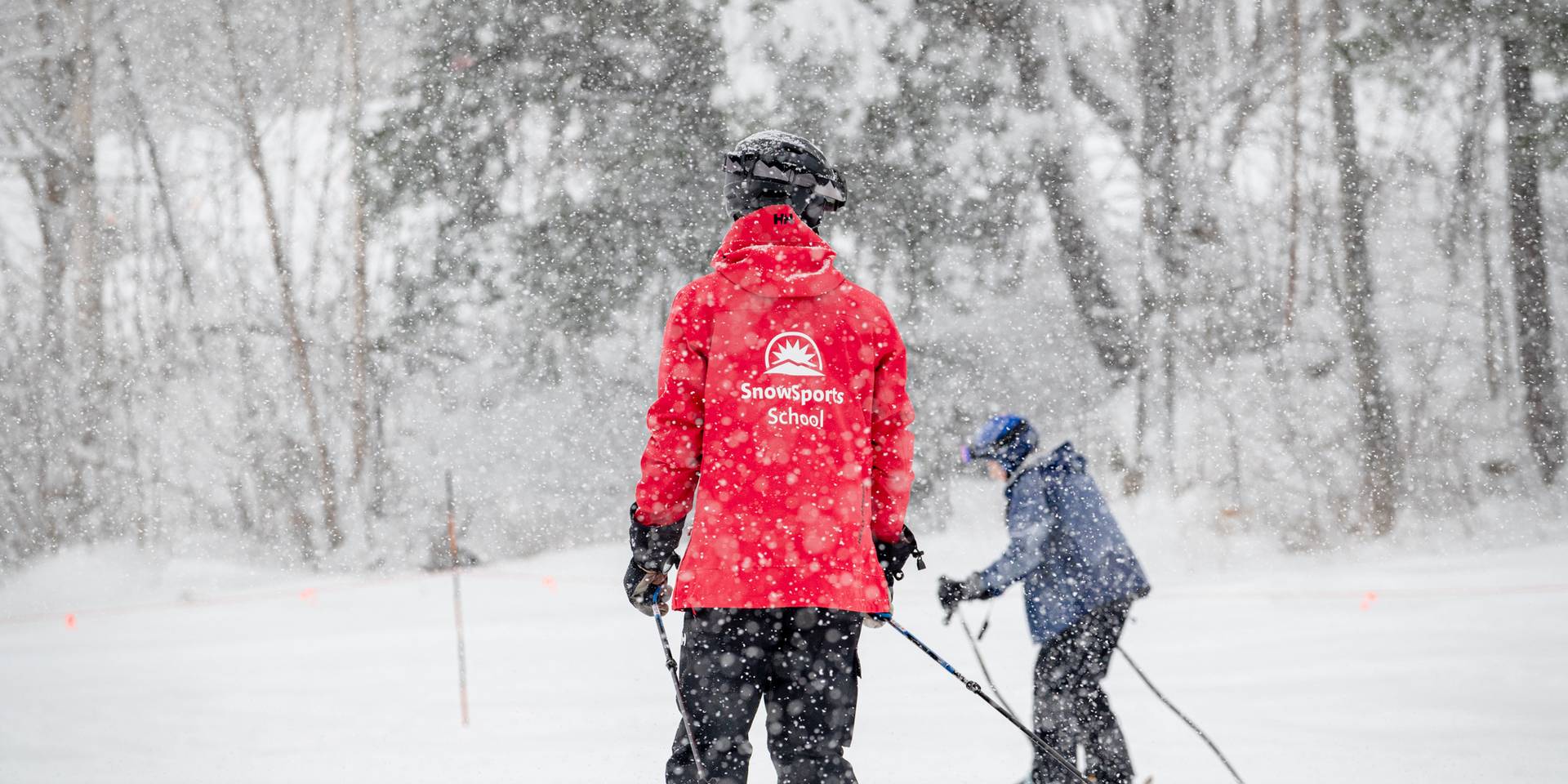 A SnowSports instructor at Sunday River giving a ski lesson.