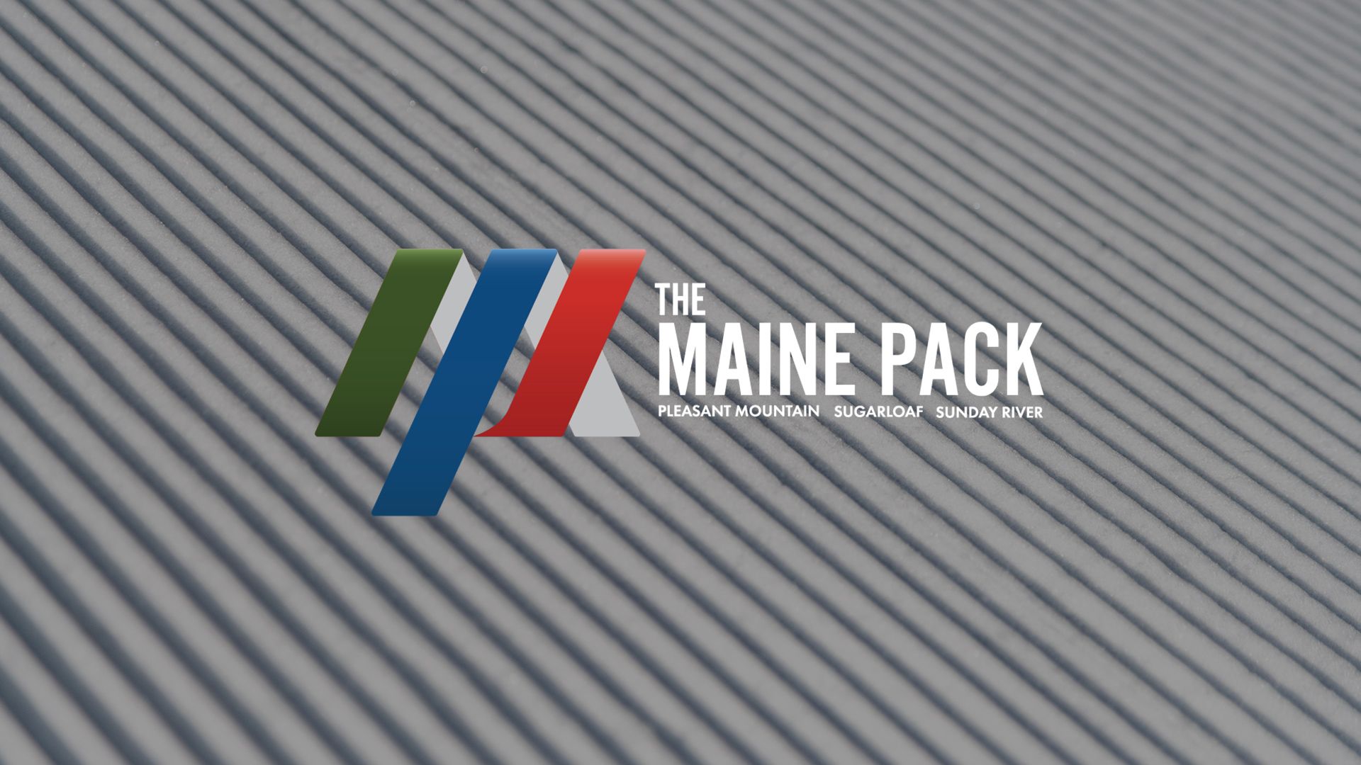 The Maine Pack logo over corduroy snow